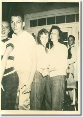 This was during one of the Humes High dance functions in August 1952, Elvis had been one of the students to volunteer as an usher, helped setup tables, food, drinks, hence why he is dressed smartly. The other students there are actually 1 year ahead of him.