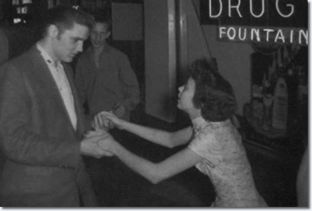 Elvis Presley with a fan after the show : April 15, 1956.