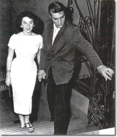Elvis and contest winner, Andrea June Stephens, walk into the hotel lobby : August 10, 1956, Jacksonville.