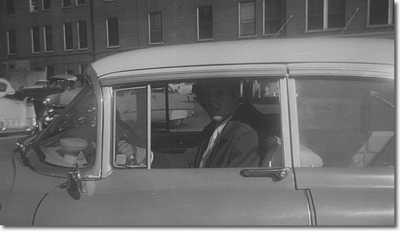 Elvis arriving or leaving in his famous Pink Cadillac after visiting his