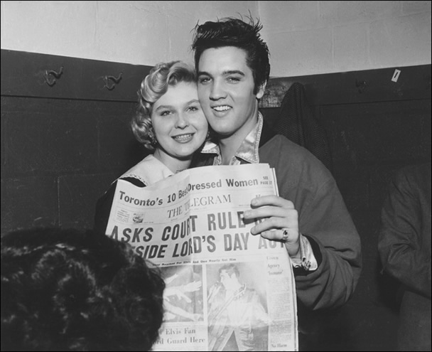Elvis poses with Miss Toronto Judy Welch.