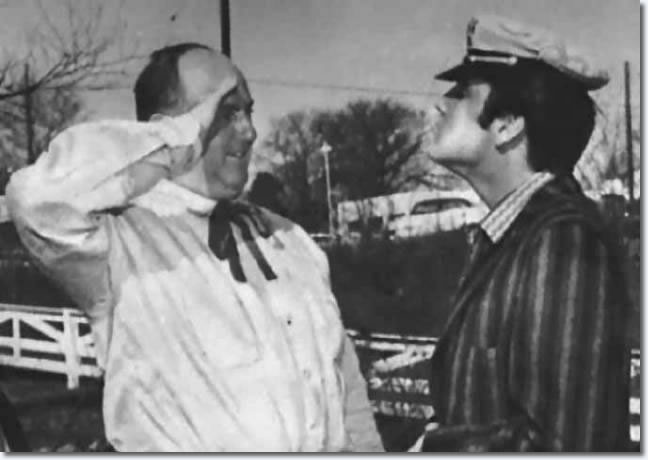 Elvis delivers his Christmas present, a red BMW Isetta, to Colonel Parke