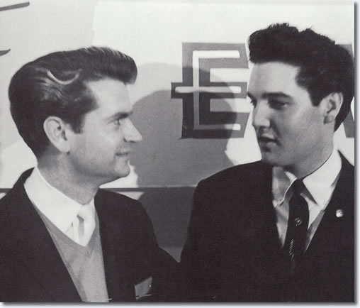 At the 1:45 pm press conference, Sam Phillips asks why Sun Records gets so little recognition for Elvis' success, reminding everyone that 'RCA wouldn't have him if it wasn't for Phillips.