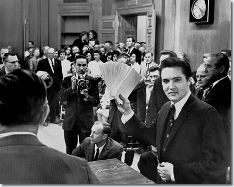 1963 to see Elvis Presley hand out Christmas checks totaling $55000.