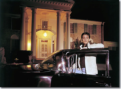 Elvis Presley posed with one of his cars outside Graceland in this 