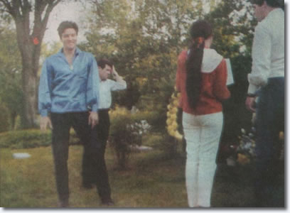 Elvis paying respects to his mother at Forest Hill Cemetery in 1966.