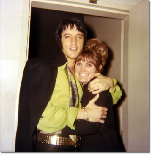 Elvis Presley, backstage with a fan in Las Vegas on February 18, 1970