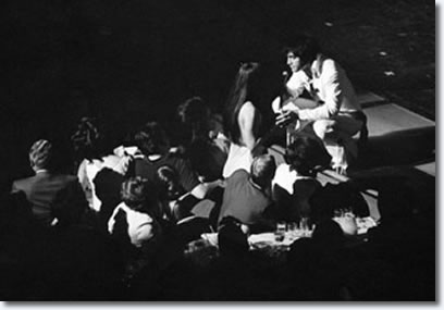 Elvis shares a moment with Priscilla while on stage at the International Hotel in Las Vegas.