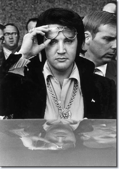 Elvis Presley is reflected in the roof of his automobile as he looks into the camera after attending a luncheon January 16, 1971 at what was then the Holiday Inn Rivermont. The luncheon was part of the festivites surrounding his being named one of the Jaycees of America's Ten Outstanding Young Men in America.
