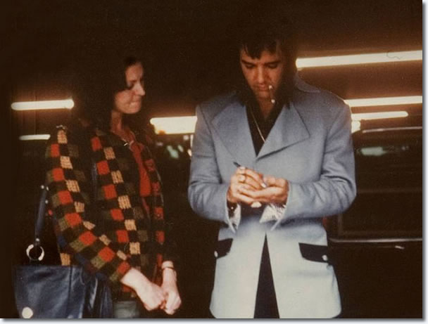 Elvis Presley, signing an autograph for a fan in Las Vegas on January 22, 1973