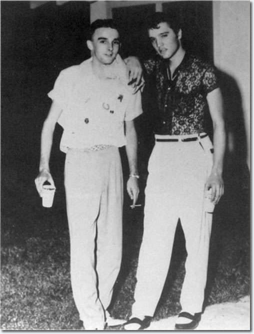 A local fan and ElvisPresley behind the Drive-In Manager's house - July 15, 1955.