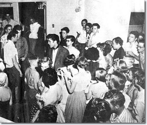 Elvis at the coliseum with Buddy Holley and Bob Montgomery looking on - June 3, 1955