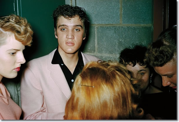 Elvis Presley signing autographs backstage at St. Michael's Hall in Broadview Heights, October 20, 1955.