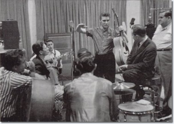 Bill Black, Chet Atkins, Scotty Moore, D.J. Fontana, Elvis Presley, Ben Spear and Steve Sholes - April 14, 1956
