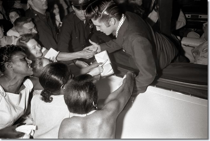 As Elvis left the Hudson Theater, his fans reached out for an autograph and to touch their idol. (NBC Television, Hudson Theater, New York City, July 1, 1956) 