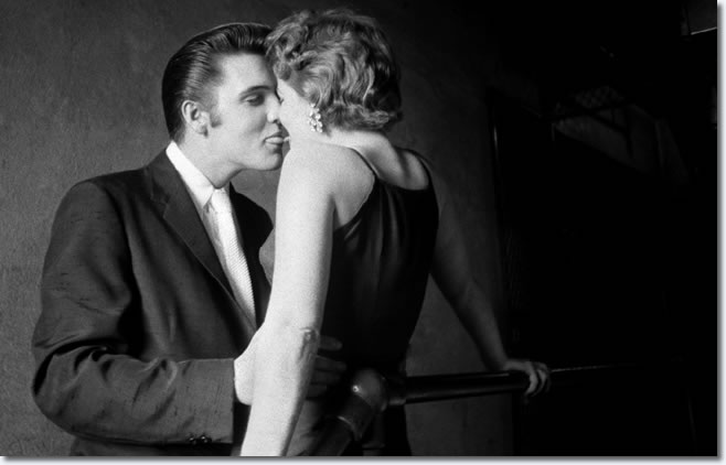 Sneaking a kiss moments before going onstage - June 30, 1956