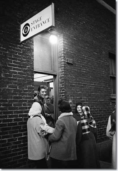 Elvis chats with some very cold well wishers who came to greet him during near freezing weather the day he appeared for the first time on the Tommy and Jimmy Dorsey variety show, “Stage Show,” produced by Jackie Gleason. (CBS Studio 50, New York City, March 17, 1956).