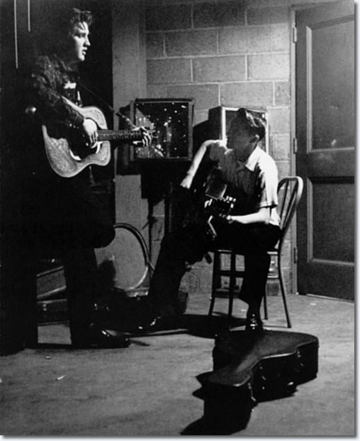 Elvis Presley and Scotty Moore between shows in the fieldhouse - May 27, 1956