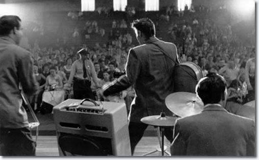 Bill Black, Elvis Presley and DJ Fontana performing during first show in the fieldhouse - May 27, 1956
