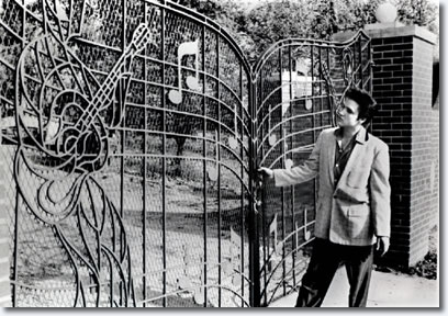 Elvis Presley at the new music gates Graceland in 1957
