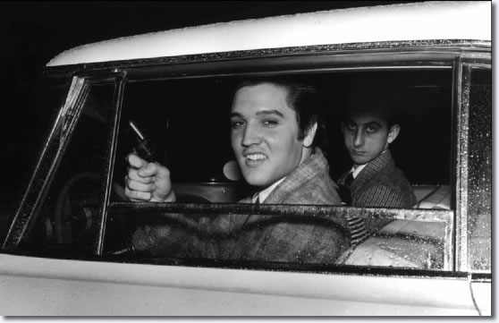 Elvis Presley displays the toy pistol that caused him some trouble on the night of March 22, 1957