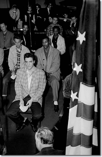 Elvis Presley on the day of his induction into the army March 24, 1958. After reporting for duty about 6:30 a.m. at the Draft Board office in the M&M Building, 198 South Main, he and other inductees would spend much of the day at Kennedy Veterans Hospital for processing and physicals before boarding a bus for Fort Chaffee, Arkansas. By the 28th, Elvis arrived at Fort Hood, Texas where he would undergo six months of training before shipping off to Germany.
