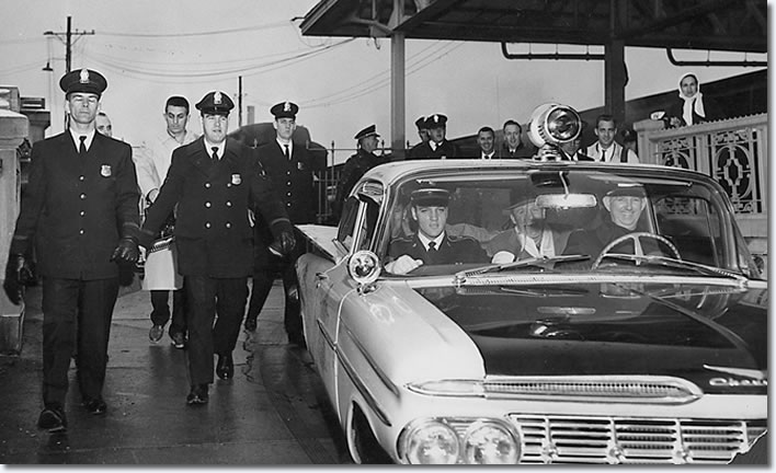 Elvis rides out to Graceland, in his friend Police Captain Fred Woodward's(Driving) squad car, Bill Burk can be seen in the back seat.