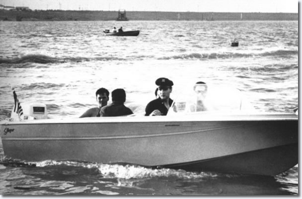 July 8, Elvis takes a spin around McKellar Lake in his new $2000 16-foot boat to water ski boat.