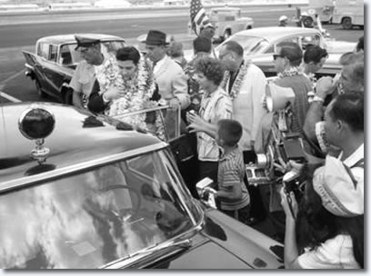 Elvis Presley : March 25, 1961 : Arriving at Honolulu Airport for that evenings U.S.S. Arizona Benefit Concert.