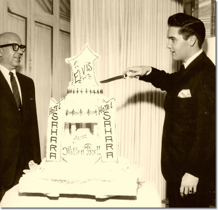 Elvis celebrates his twenty seventh birthday in Las Vegas with a cake supplied by the casinos owner and friend of Colonel Parkers, Milton Prell, January 8, 1962.