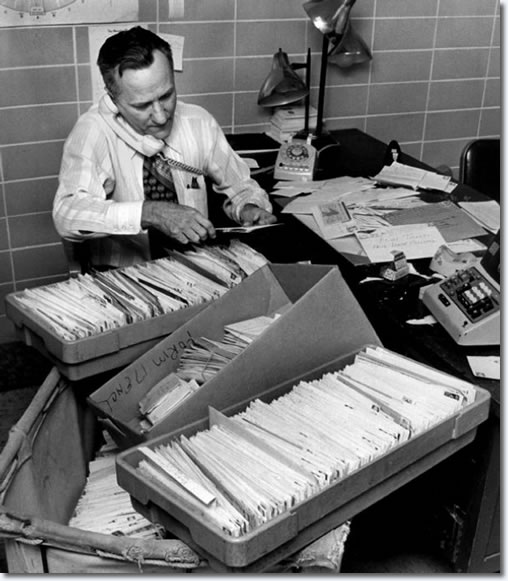 Mid-South Coliseum ticket office manager Harry Brewer sorts through mail-order requests in January 1974 for tickets to three Elvis Presley concerts on March 16 and 17. Coliseum manager E.E. Bland said that 4,000 requests were received during the day and that the concerts are expected to sell out in a hurry.