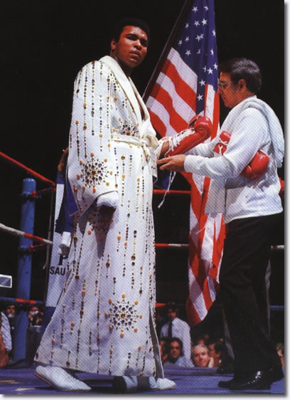 Muhammad Ali wearing the robe given by Elvis. March 31, 1974