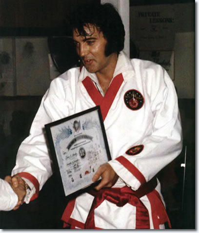 Elvis receives his 7th degree black belt from Kang Rhee.