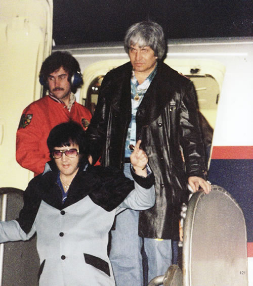 Elvis Presley departing the Lisa Marie and heading to his hotel shortly after midnight February 20, 1977.