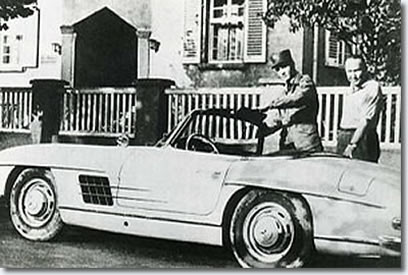 Elvis and Hal Wallis Standing next to a Mercedes-Benz sports car (type: 300 SL)