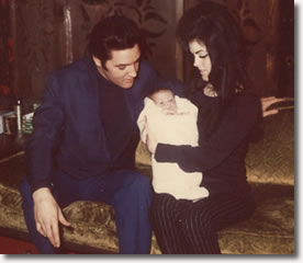 Elvis and Priscilla with baby Lisa Marie at home