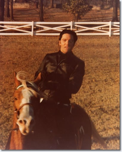 Elvis Presley at Graceland riding Rising Sun