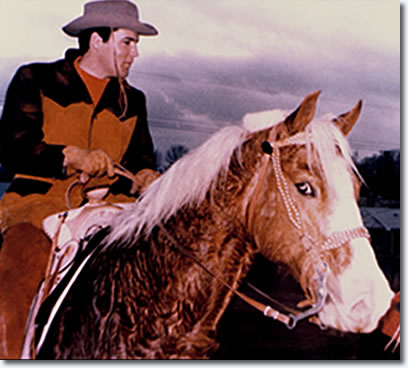 Elvis Presley at his Circle G Ranch, Mississippi riding Rising Sun.